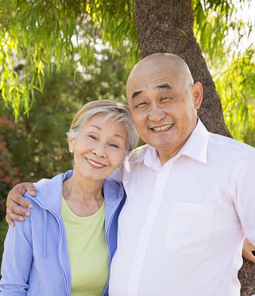 Senior couple smiling in the sun