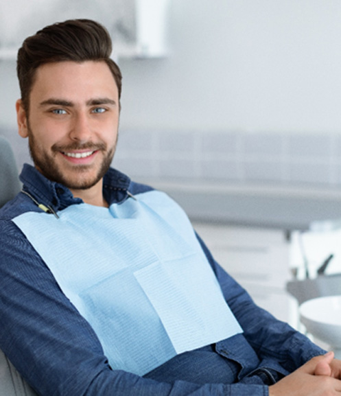 Man sitting in dental chair smiling